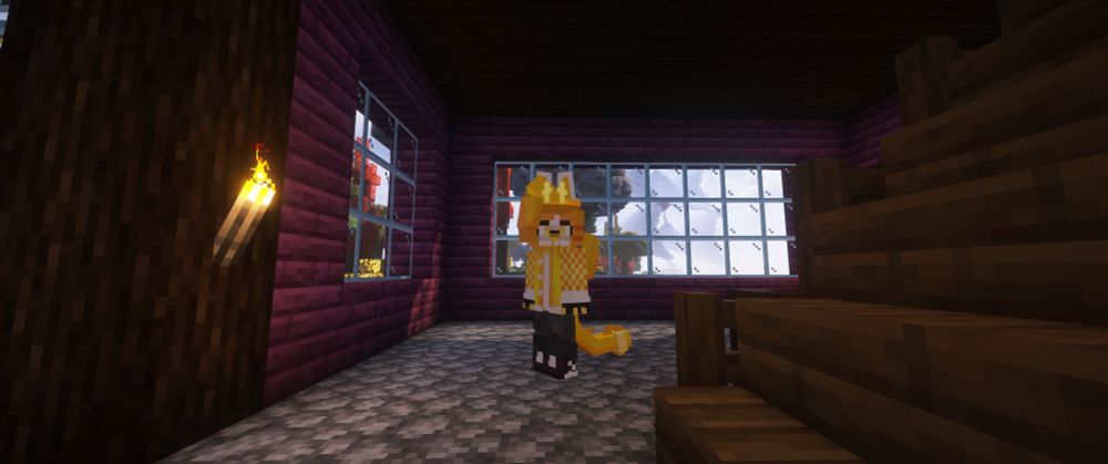 A screenshot of a custom minecraft playermodel, a yellowish character with ears, modelled hair, and a long tail which hangs above the ground.