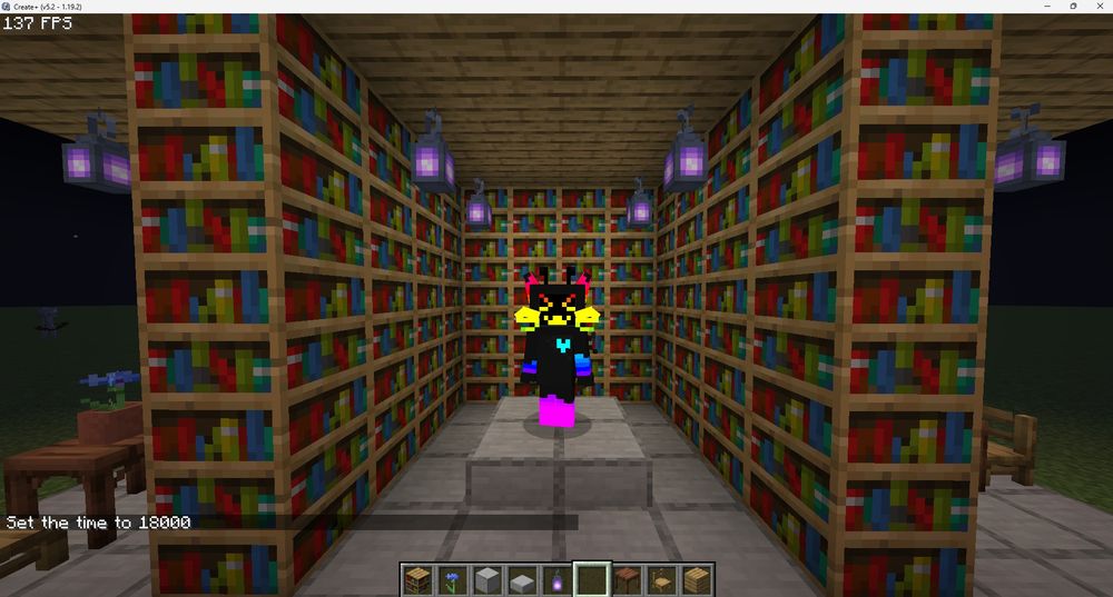 A minecraft screenshot with a player in the middle of many bookshelves. They have a TV screen for a head, with cat ears and whiskers. Their body is all black, accented with rainbow gradient details.