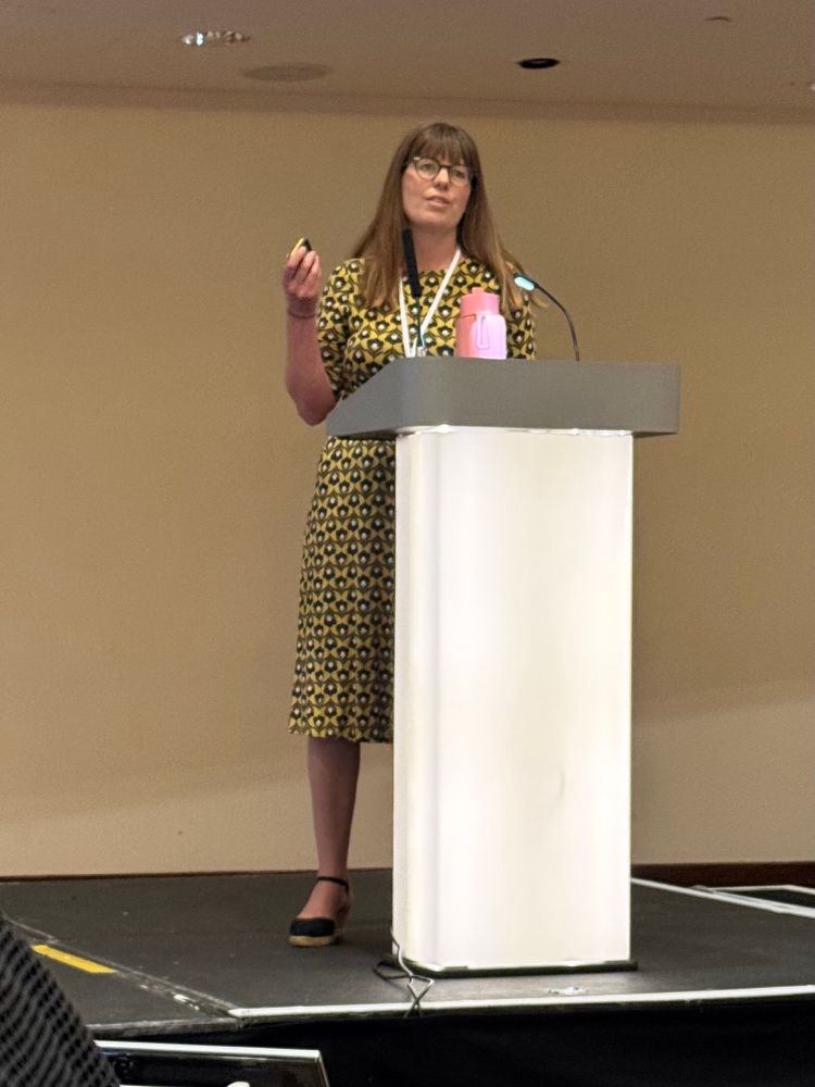 Polly Duncan on stage, presenting at SAPC