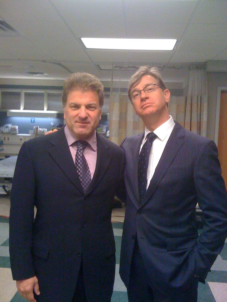 Picture of two guys in suits. 