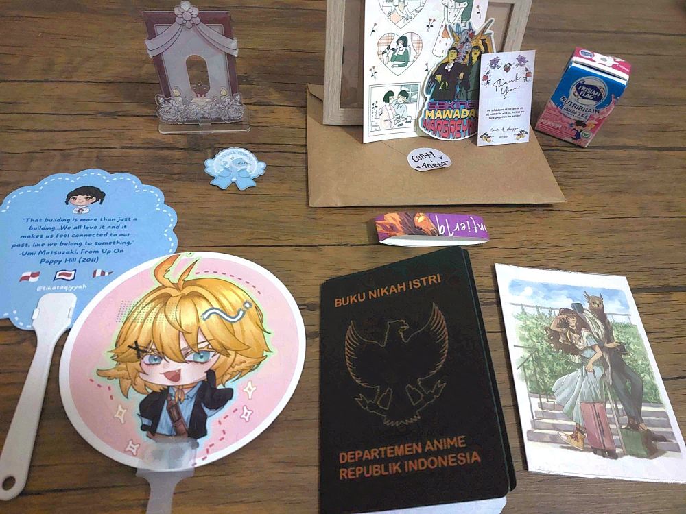 Miscellaneous other CF19 hauls
- Acrylic photocard holder standee
- When the Past was Around artprint (love this game since even before release)
- Dokibird hand fan (I just asked for a pic bcs alena's doki cosplay is just so good and alena gave me this hahahaha tyy)
- Wedding certificate parody (Yet another it's too funny to not buy stuff. I even bought 2. Maybe I'll put in yumeship with Hoshina in one hehe)
- Literal wedding souvenirs (I was just randomly passing when I recognized the decors from a twt post a week prior. At the time, I was wondering if it was weeb themed wedding or wedding themed weeb event. I wasn't expecting to see them at CF so I blurted out "You guys the ones from last week?". They ushered me in to fill in the guestbook spreadsheet. I was like, sure... Then they actually gave me wedding souvenirs (print, stickers, and frame), meatball, and milk. Like ???? Attending a wedding wasn't in my bingo card LMAO. And how do you know that I, a weeb event visitor, will buy an A5 print without a plan to display it?? WKWKWKW Very useful 10/10)