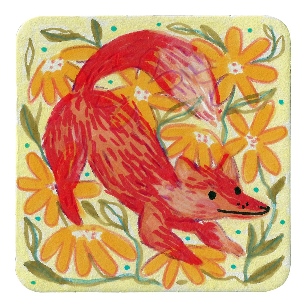An orange fox amongst yellow flowers painted on a coaster 