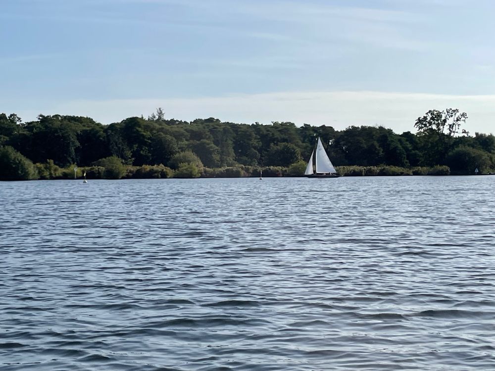 A sailing boat on Wroxham Broad, Norfolk