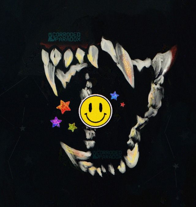 A digital drawing of a set of canine teeth. Inside the canines teeth are stars stickers with a smiley face sticker in the middle 
