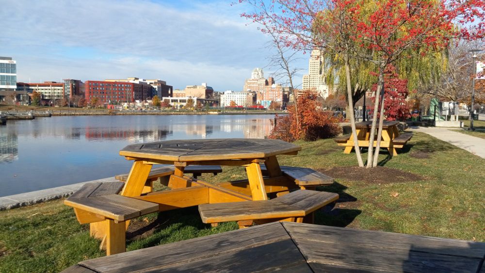 riverside city park with octagonal picnic tables