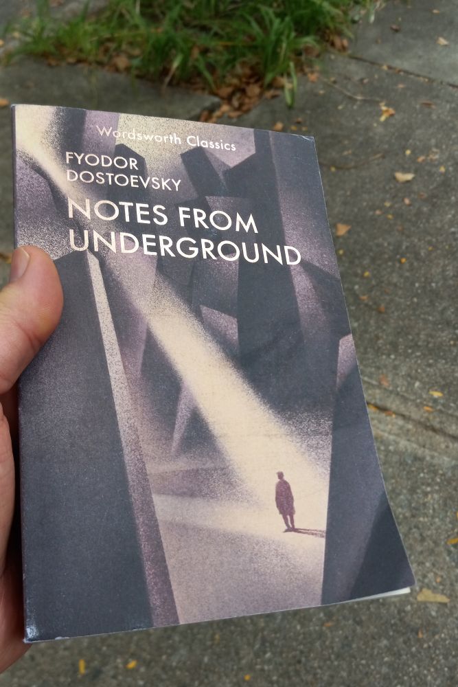my hand holding a copy of Dostoevsky's Notes From Underground