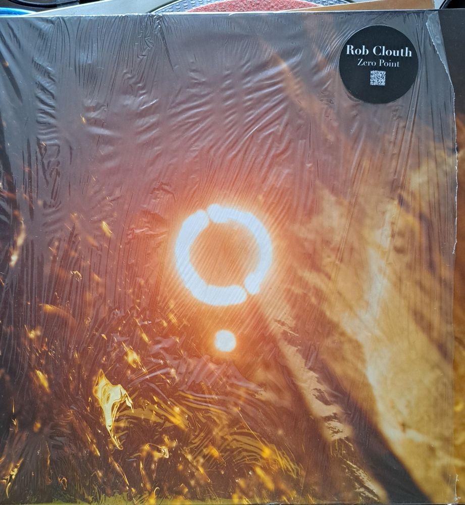 Record sleeve for Rob Clouth - Zero Point. A ring of light appears in the centre of some textured organic images.