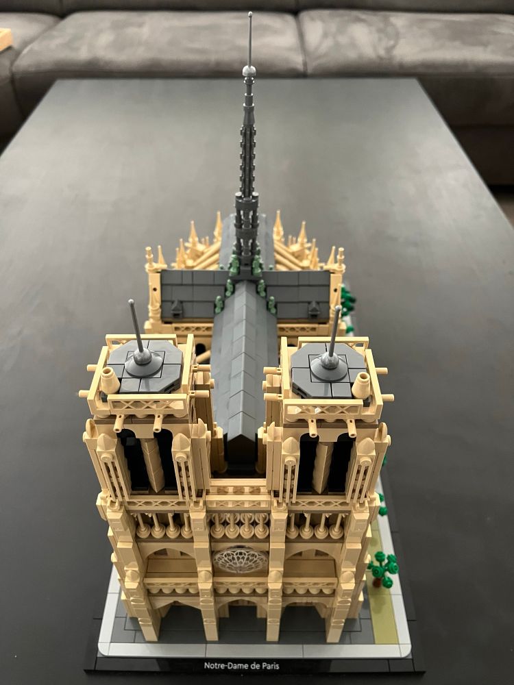 Notre Dame is complete. Spire has been added to the roof. Also twelve statues representing the apostles look out over Paris. Except the one with the face of one of the main restorers who admires the spire. Greenery also added along the side of Notre Dame. 