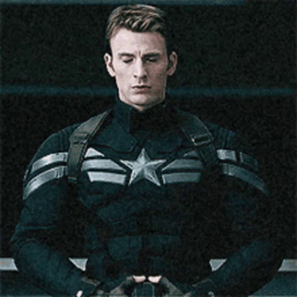 a close up of a man in a captain america costume