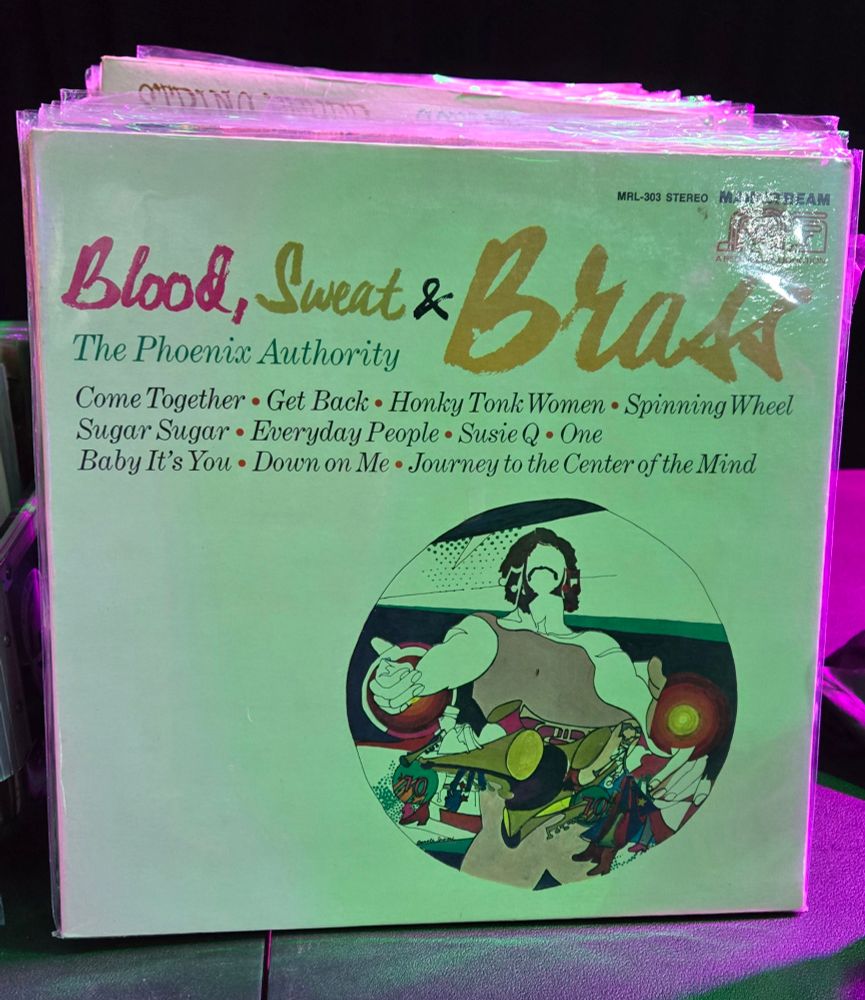 Photo of Blood Sweat & Brass LP cover with a psychedelic graphic.