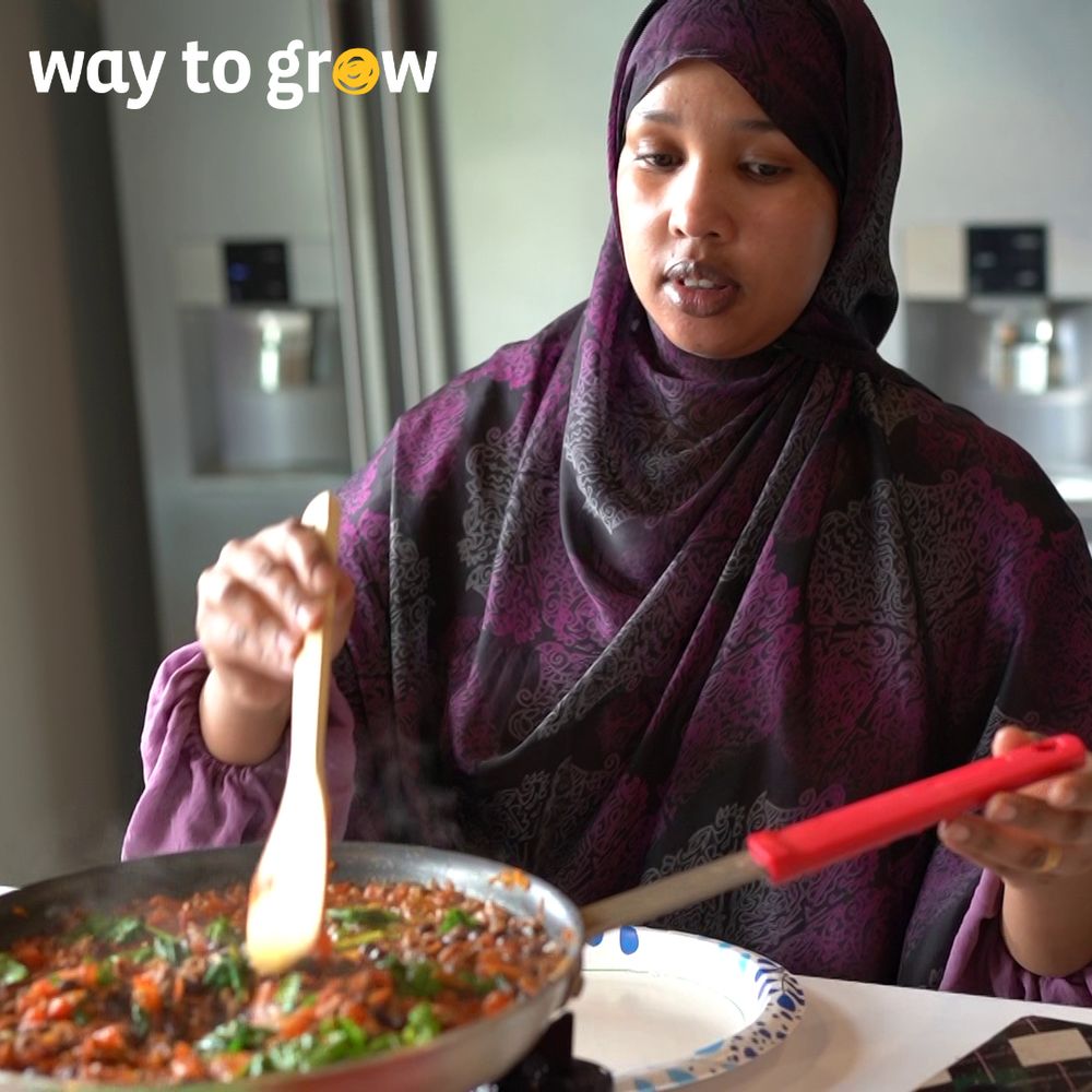 Parent cooking a new recipe during Cooking Matters session