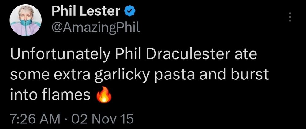 Tweet from Phil Lester posted on 2 November 2015 that says "Unfortunately Phil Draculester ate some extra garlicky pasta and burst into flames" with a fire emoji at the end.