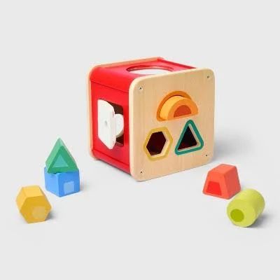 Colored shapes and a box with matching holes.