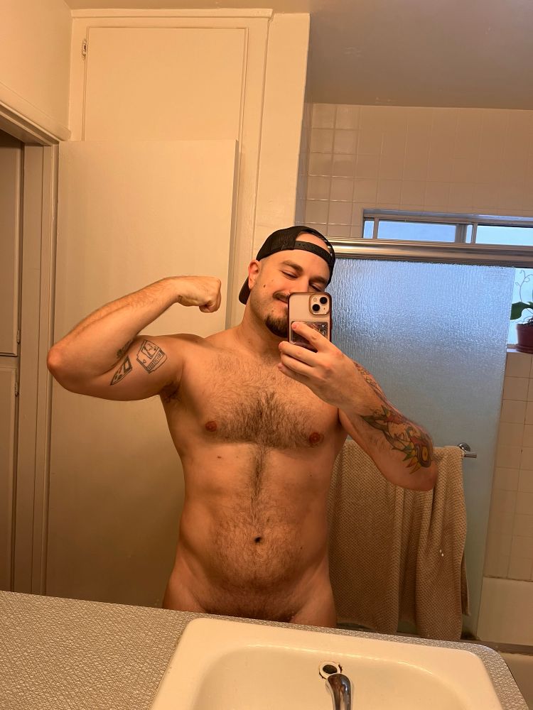 I’m flexing shirtless with a little bush showing.