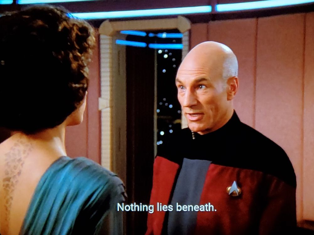 Picard is in his ready-room, and is very defensively saying "nothing lies beneath" to someone who is trying to get more intimate with him.