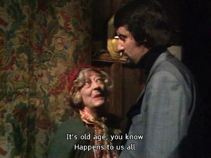 Screen shot from Doctor Who: The Seeds of Doom (1976). Amelia Ducat talking to Scorby, subtitle reads "It's old age, you know. Happens to us all."