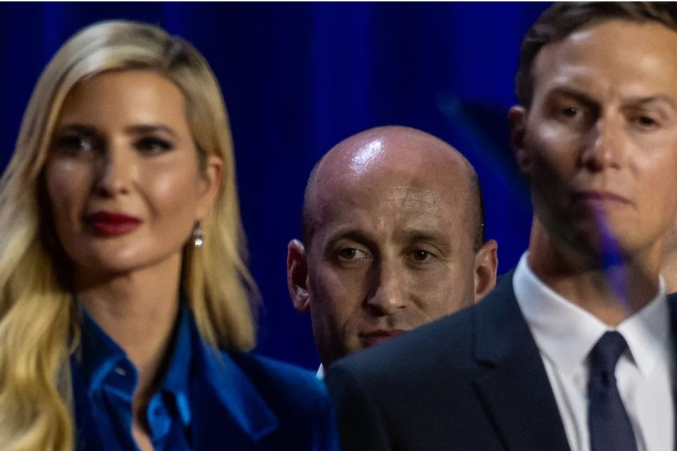 Lil' Stephen Miller, probably on his tippy toes, as he watches a speech standing behind Jared Kushner and Ivanka Trump. His face is partially obscured because he's so short and has to peep over their shoulders to get a good view of the speaker. 