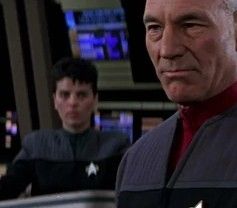 A zoomed in screen grab of Captain Jean-Luc Picard, and the famous Star Trek TNG background character, Lt. Jae, played by Tracee Lee Cocco from the file Star Trek: First Contact