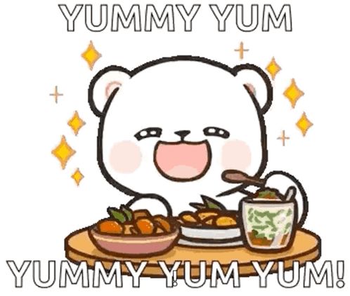 a cartoon bear is sitting at a table eating food and drinking a cup of tea .