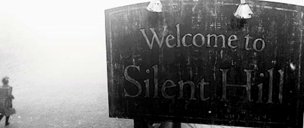 a black and white photo of a welcome sign to silent hill .