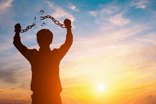 Man breaking shackles