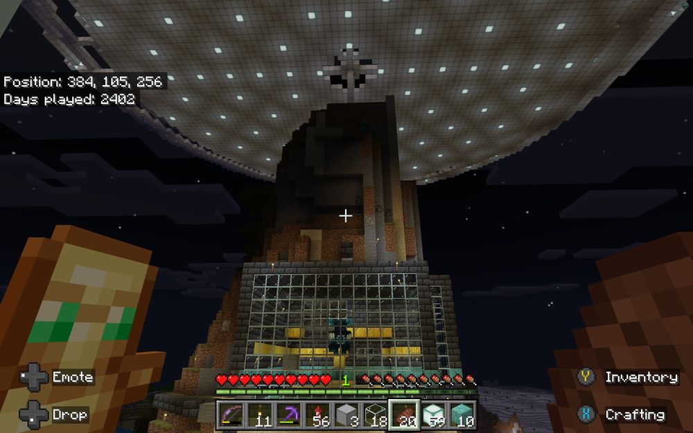 Screenshot from Minecraft game of a Warden in a glass walled room decorated with gold and prismarine blocks built into the side of a mountain with an Independance Day like UFO under construction above. Totem in hand because they are super dangerous to be around.