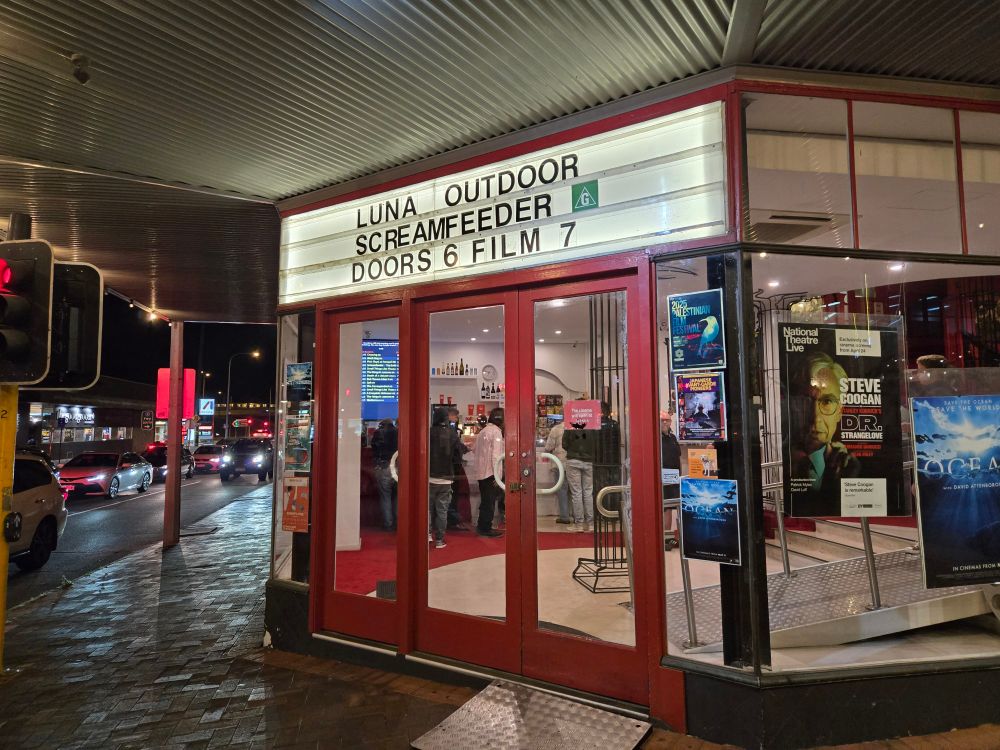 Front sign at Luna Cinema say Screamfeeder Doors 6 Film 7
