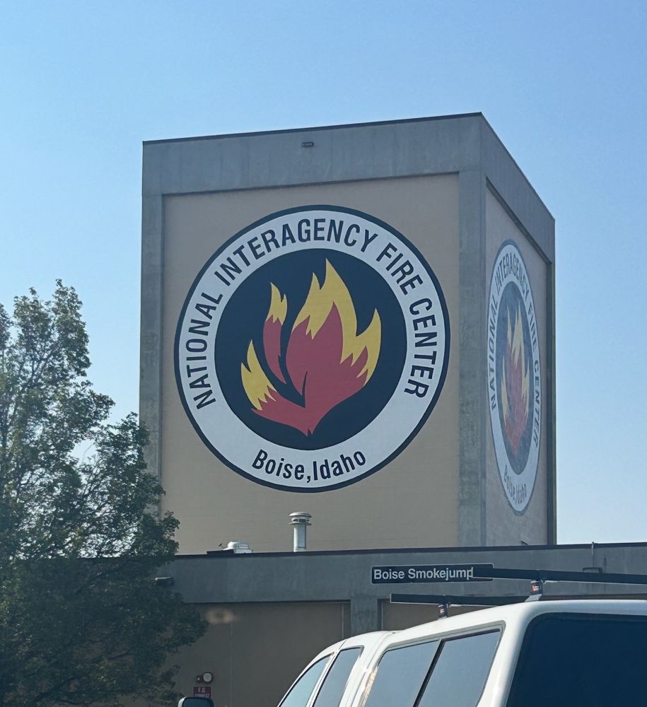 A tower in Boise with the emblem for the National Interagency Fire Center on it. 