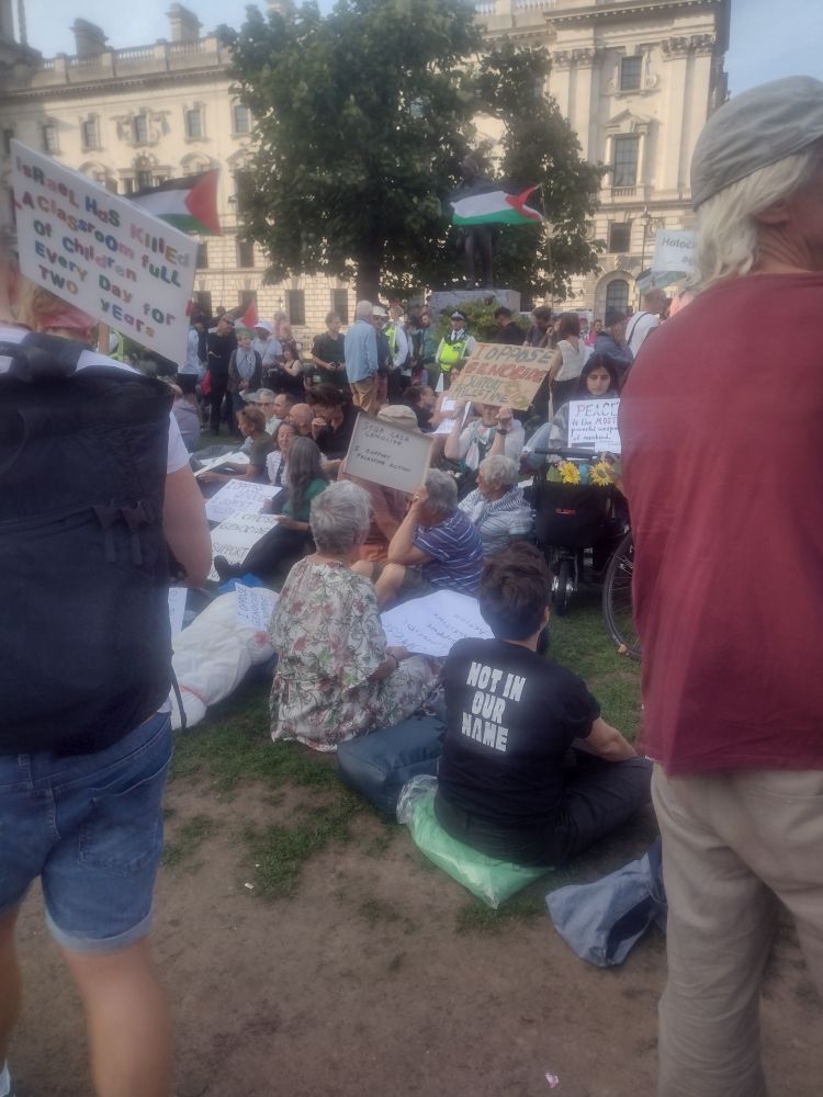 People awaiting arrest in Parliament Square.