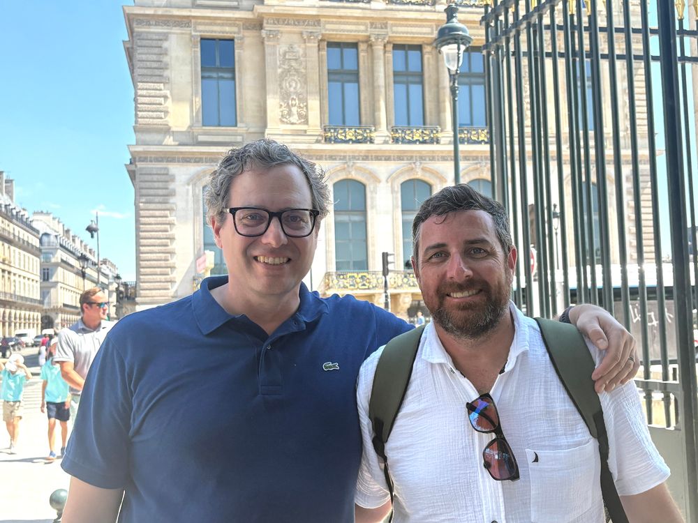 Two classmates in front of the Louvre