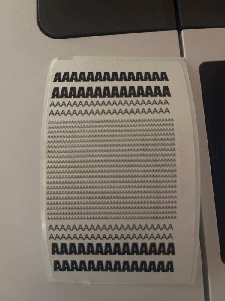 A sticker with only As in different font sizes 