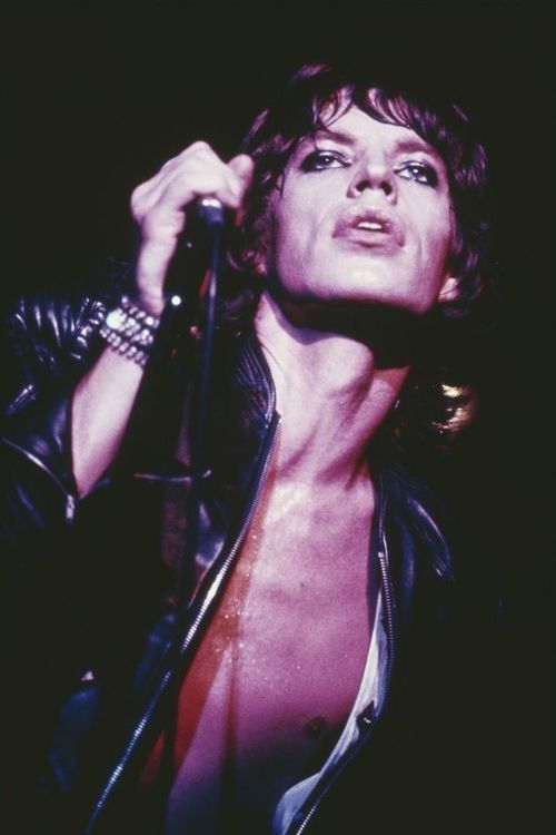 Mick Jagger absolutely serving cunt on stage  with his beautiful hair, sparkly but moody makeup, and slutty little outfit