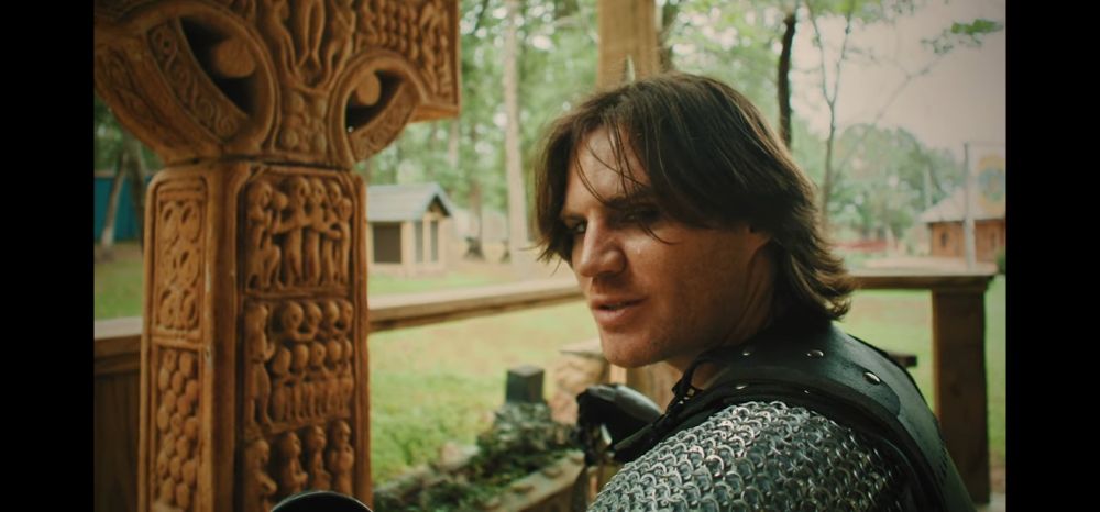 Will Neif in medieval armour, longer hair and wearing eyeliner. He looks very hot.