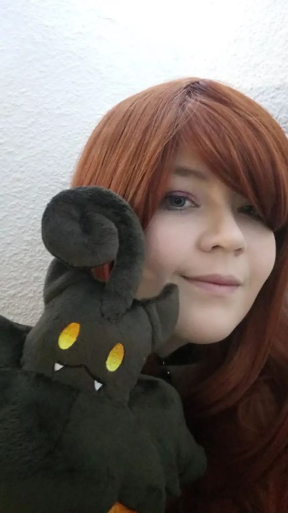 A selfie taken with a pumpkaboo plush 