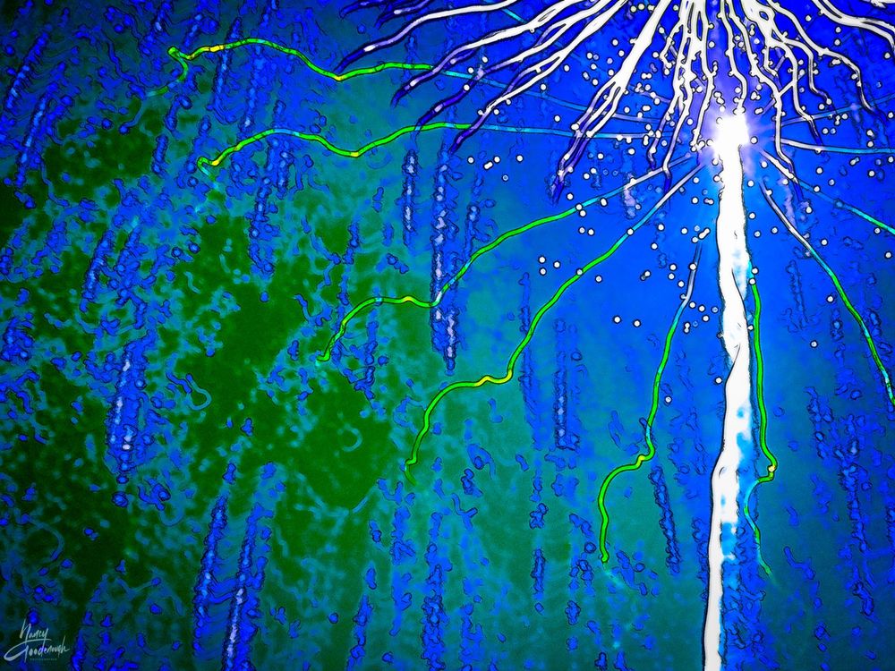 Titled "Ice Goddess" image has a Tesla-Tower-like look (Nicola Tesla, not the car!), posted for Alphabet Challenge with the theme Week K for Kinetic. 

It has lots of kinetic energy.

Sky is cobalt blue with green shadows. the Ice Goddess is a white column with a glowing white head and tentacles of white and green emanating out like Tesla Towers do. 

It's actually a photograph taken in 2010 of local fireworks for US Independence Day. 