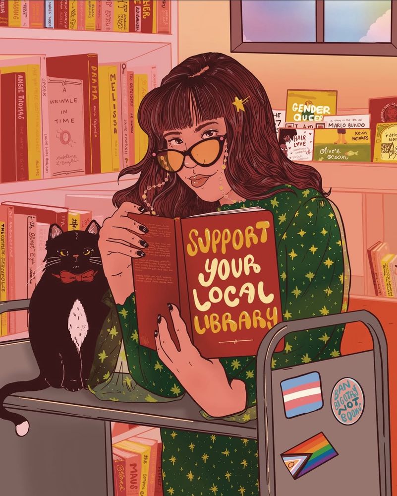 Artwork depicting a brown haired woman in a starry dress and glasses reading a book titled support your local library while leaning on a book cart surrounded by shelves of books. A Trans flag and pride flag are stickers on the side of the cart. A cat wearing a bow tie is also seated on the cart. 