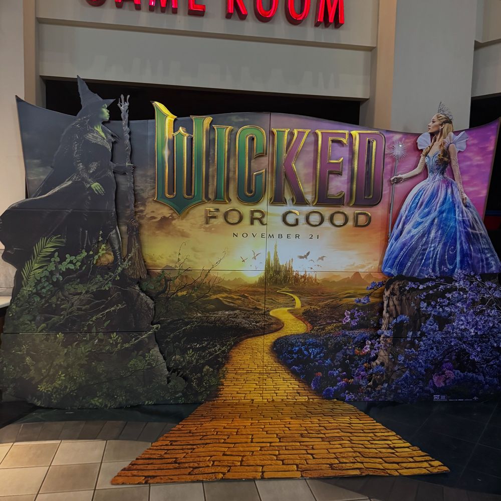In theater standee for Wicked: For Good