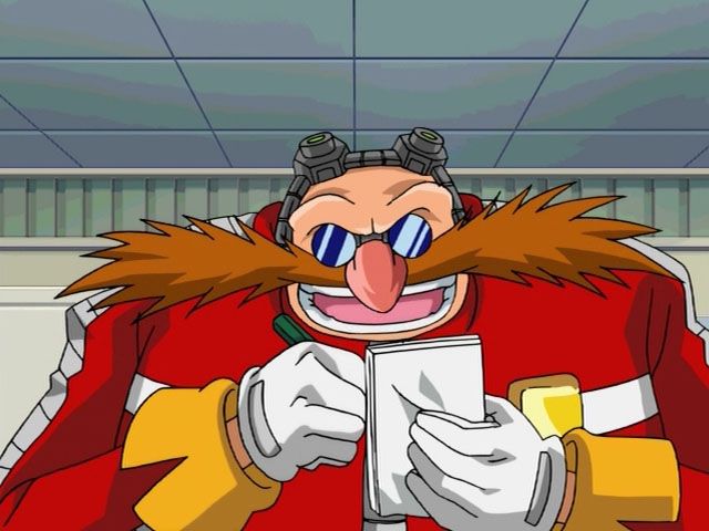 Sonic X Eggman with a pen and paper in his hands, smiling
his goggles kind of give the illusion that he's wearing a headset