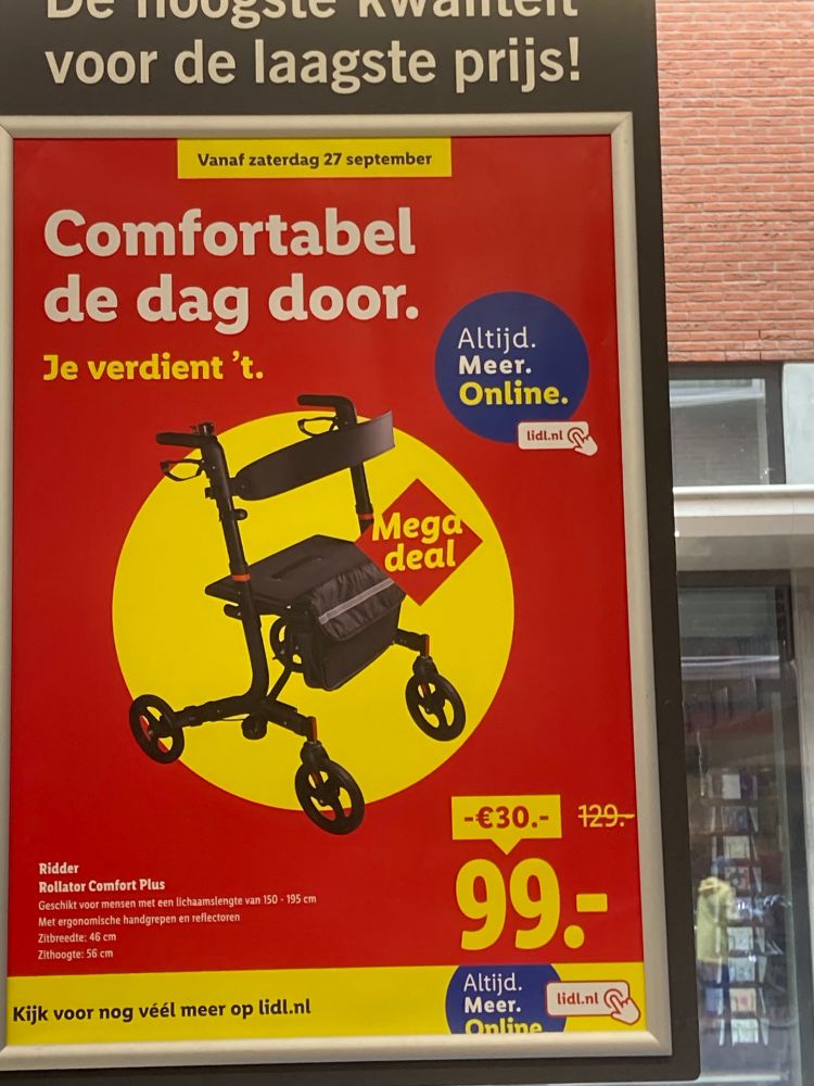 Poster in de Lidl; afgeprijste rollator van €129 voor €99 met als titel “comfortabel de dag door, je verdient het”