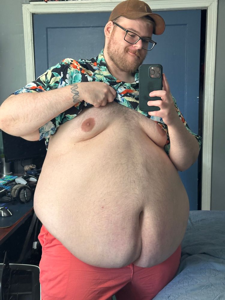 A photo of me, lifting up my shirt, focused on my torso