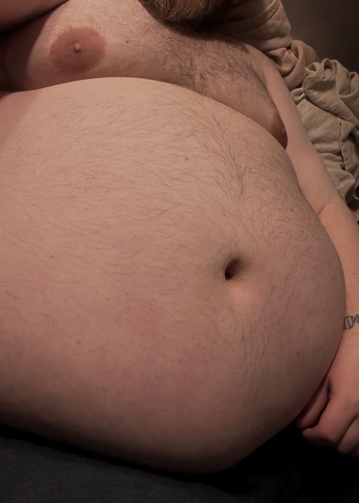A photo of me, languid from insomnia, focused on my belly