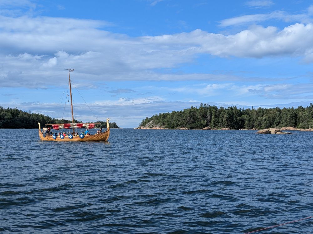 Viking ship coming from the left.