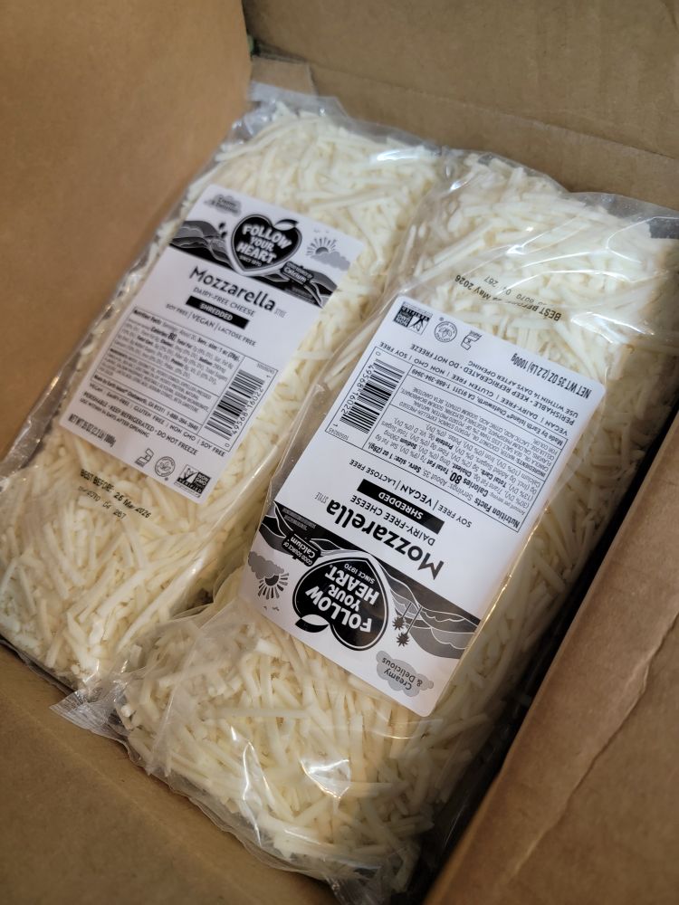 2 packs of vegan Mozzarella visible in a cardboard box