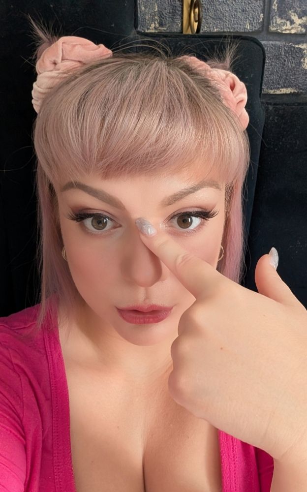 Picture of me with my finger on my nose to stop my phone from putting that weird white line there like it always does