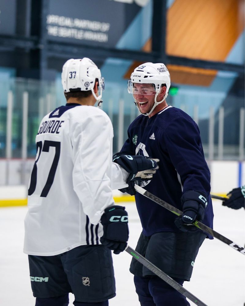 Yanni Gourde and Vince Dunn smiling and laughing at Kraken Community Iceplex.
