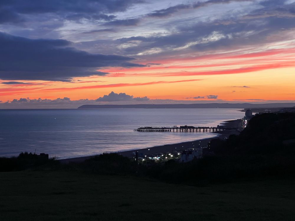 Tangerine sunset over Hastings with the pier in the background. 