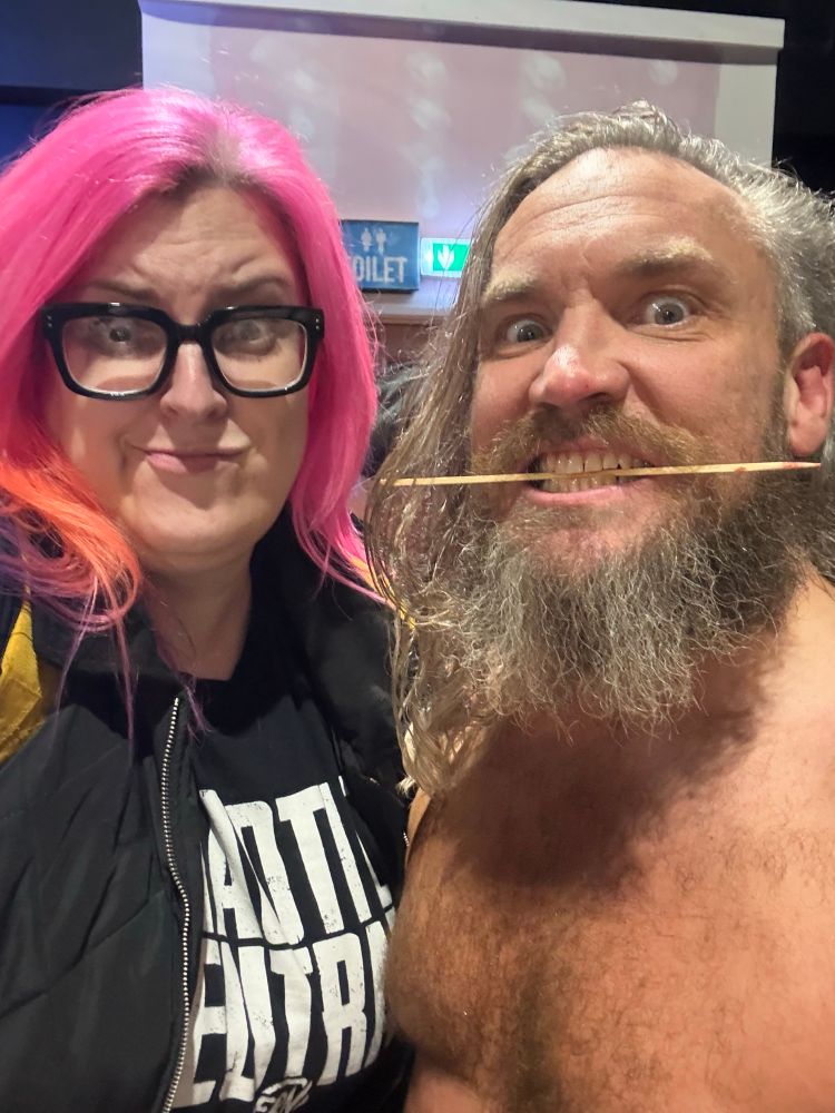 Me making a horrified expression next to Trent Seven, who is holding a bloodied skewer in his teeth