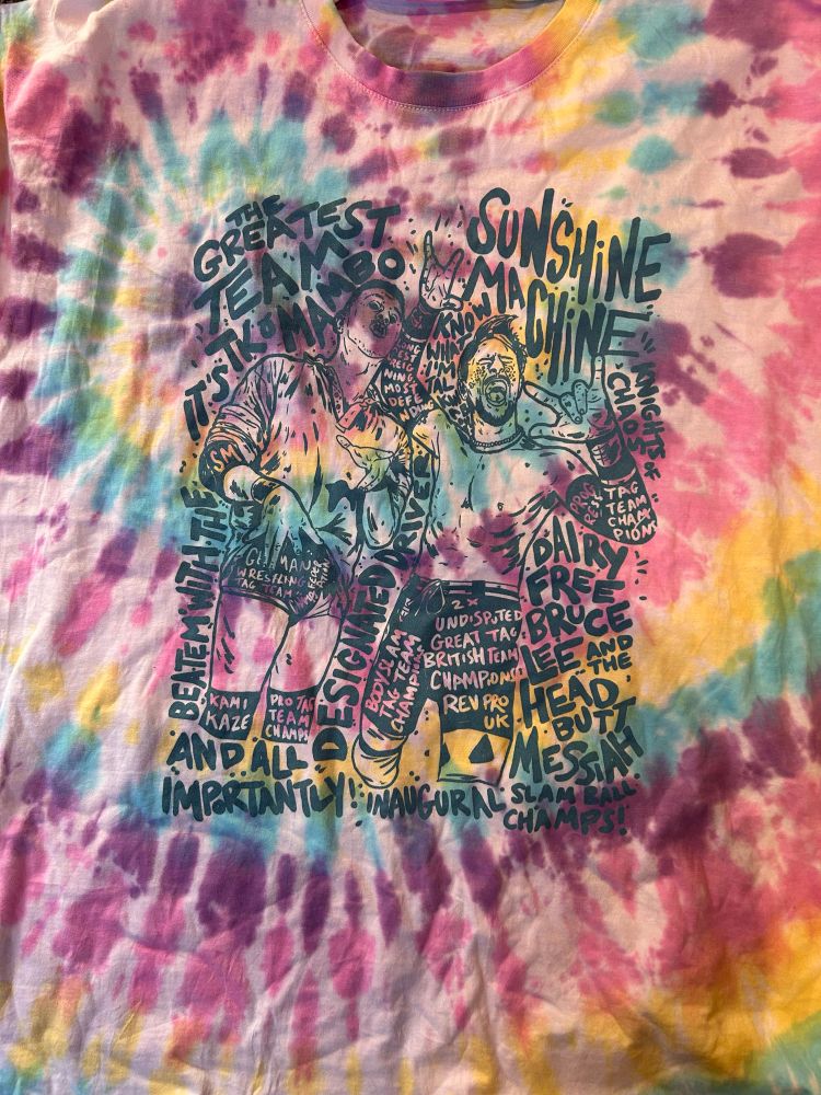A tie-dye Sunshine Machine shirt, dyed in shades of pink, purple, blue and yellow