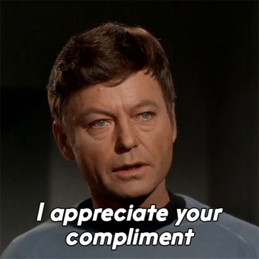 a man says " i appreciate your compliment " in front of his face