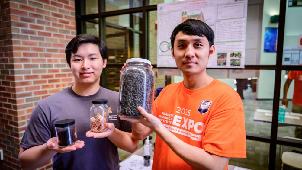 Two people showing materials in jars!